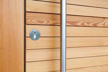 Front door with larch wooden slats